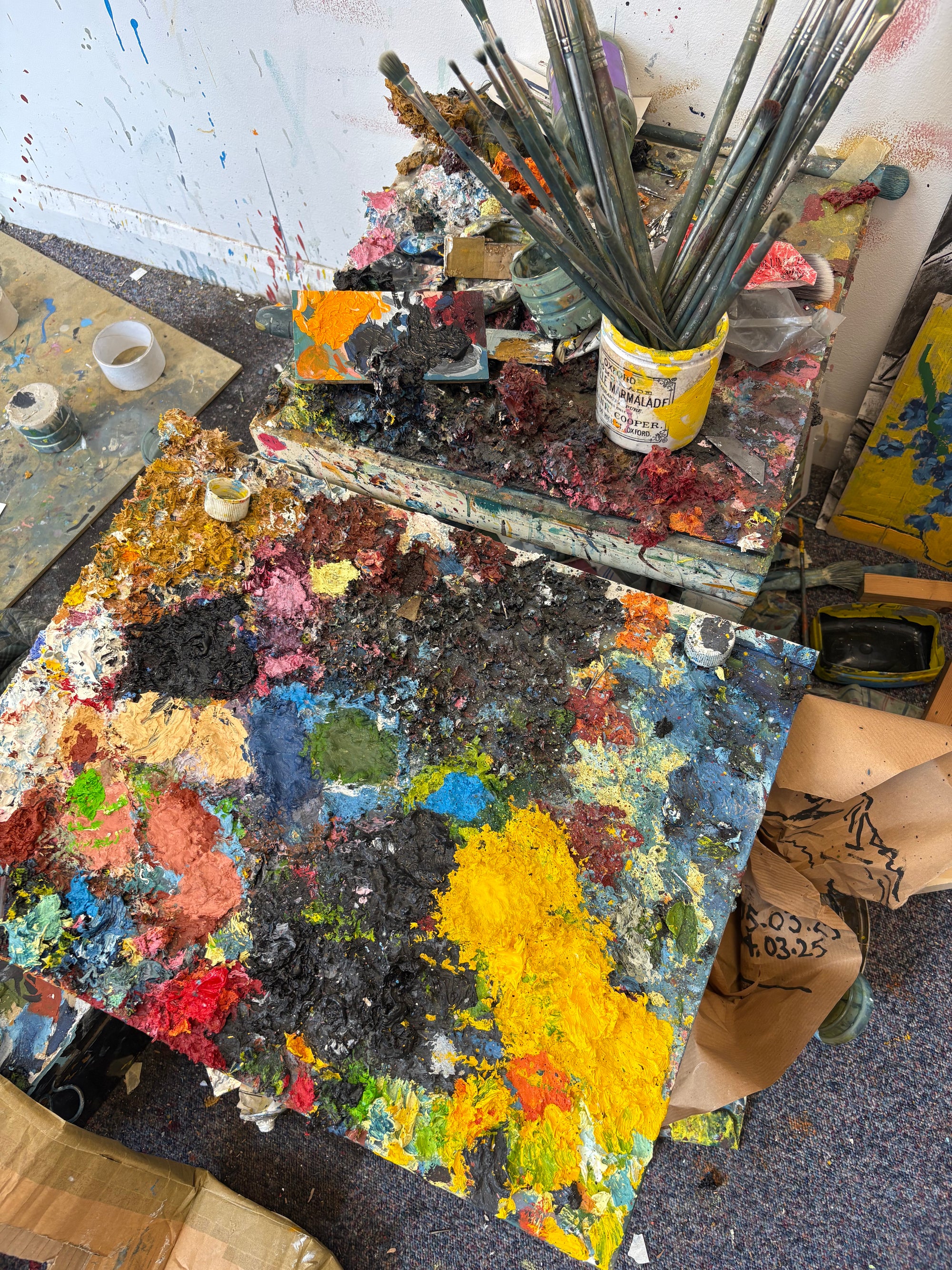 Artistic palette with colorful paint swatches and artist brushes.